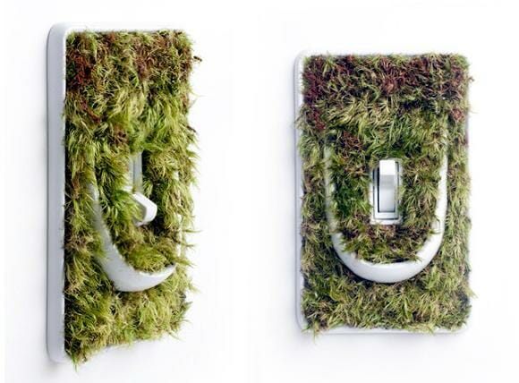 Interruptores e tomadas cobertos por plantas incentivam usuários a "pensar verde".